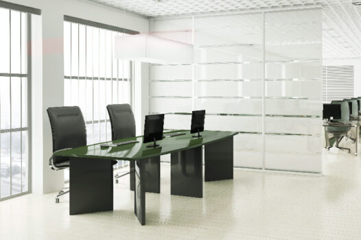 A conference room with four chairs and a table.