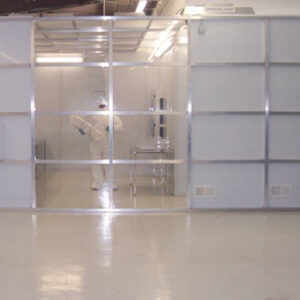 A room with many glass walls and white floors.